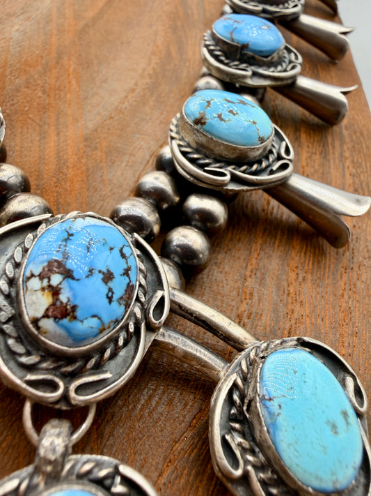 Close-up of Golden Hills turquoise matrix, silver rope and scroll details