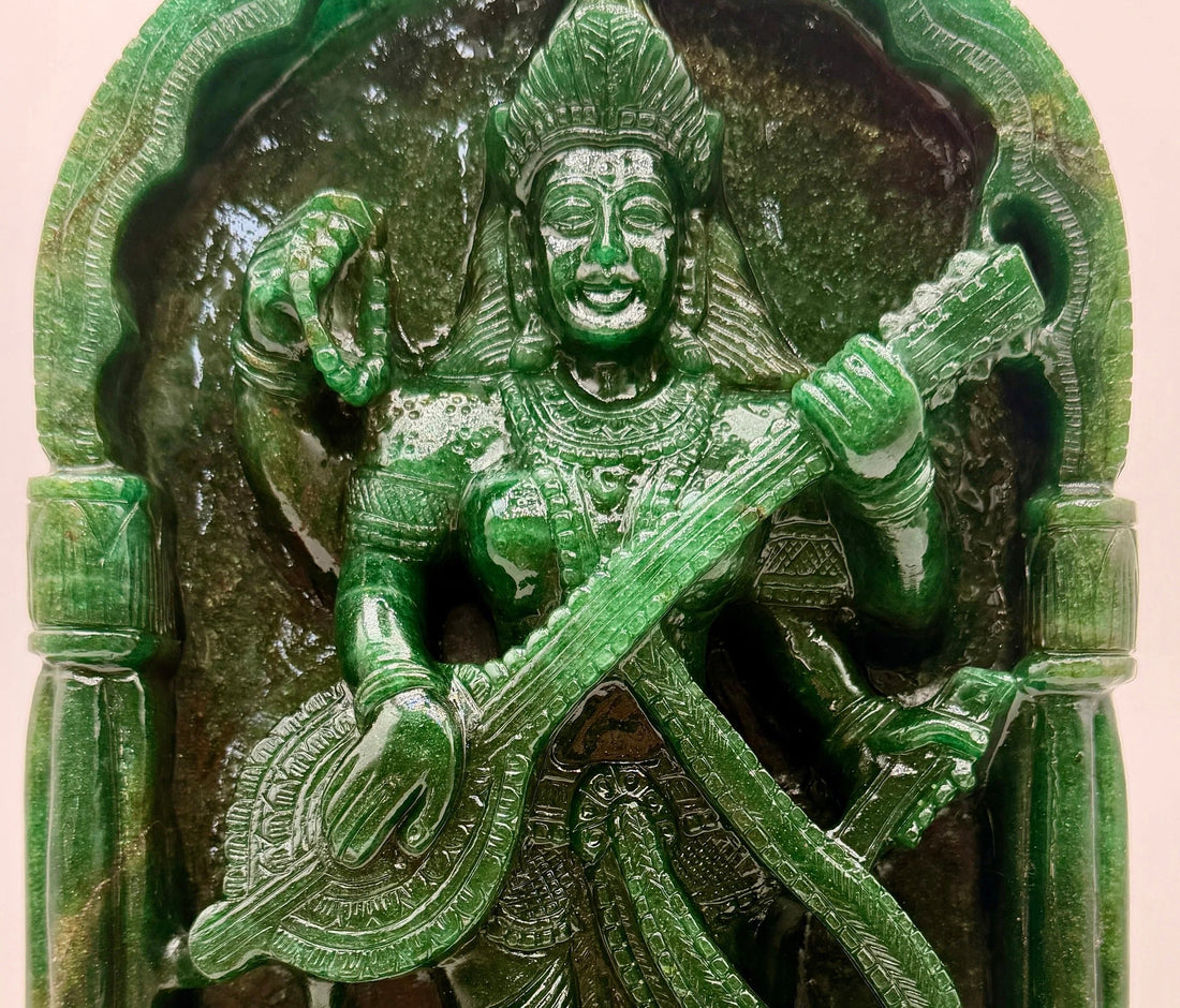 Hand-carved crystal Saraswati statue with veena representing knowledge, wisdom, music and creativity