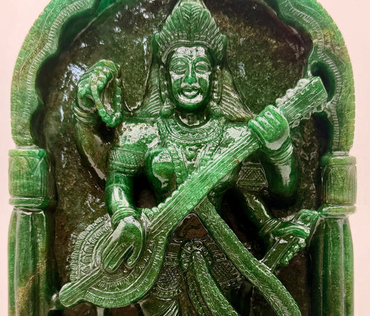 Hand-carved crystal Saraswati statue with veena representing knowledge, wisdom, music and creativity