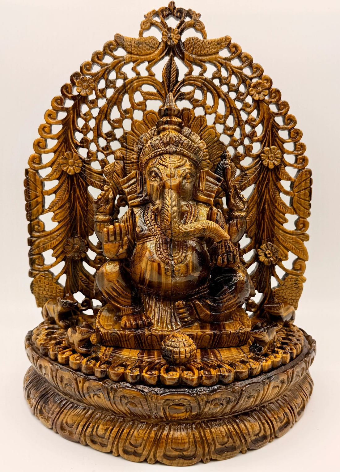 Hand-carved natural Crystal Ganesha statue displayed on a sacred crystal altar with collector-quality gemstone craftsmanship.