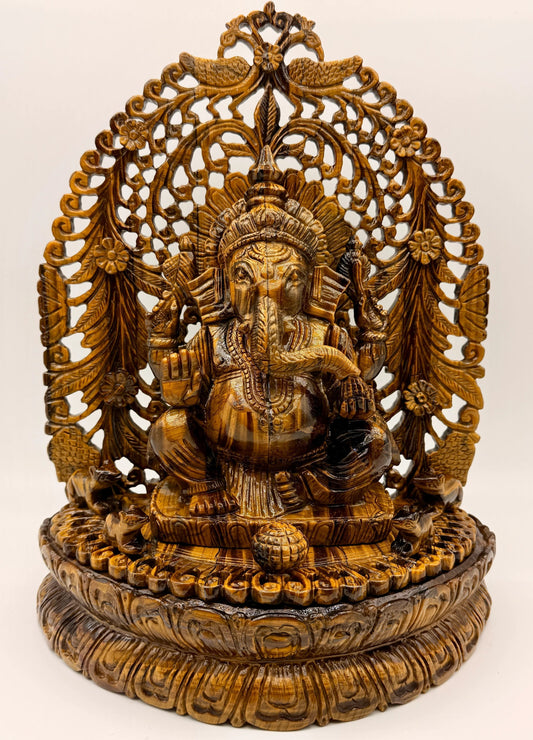 Hand-carved natural Crystal Ganesha statue displayed on a sacred crystal altar with collector-quality gemstone craftsmanship.