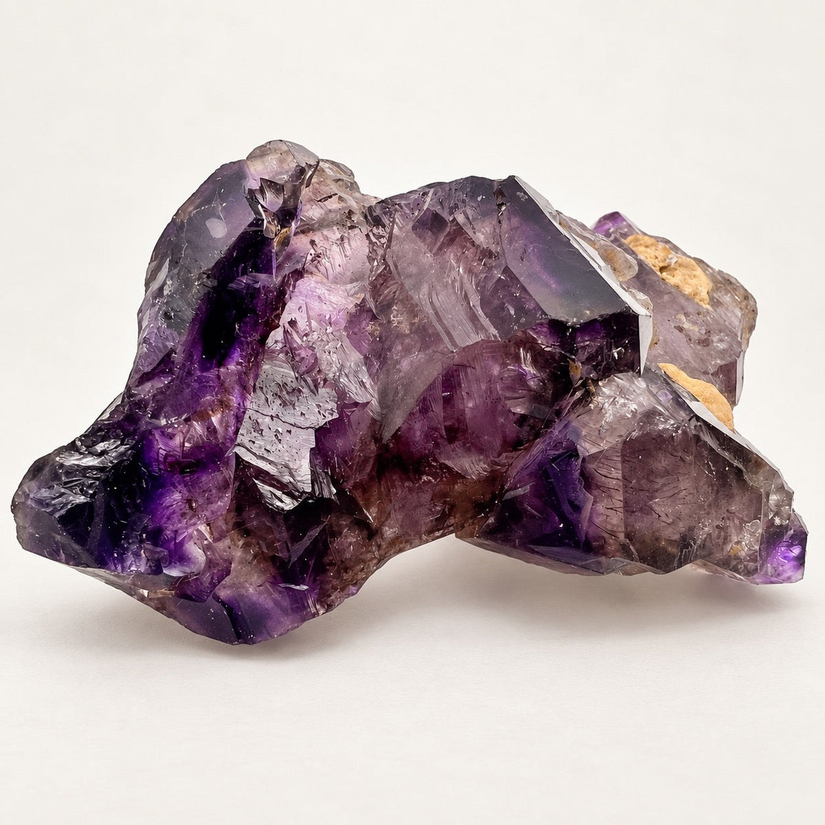 Natural African elestial amethyst cluster with deep-violet color zoning and layered crystal formations
