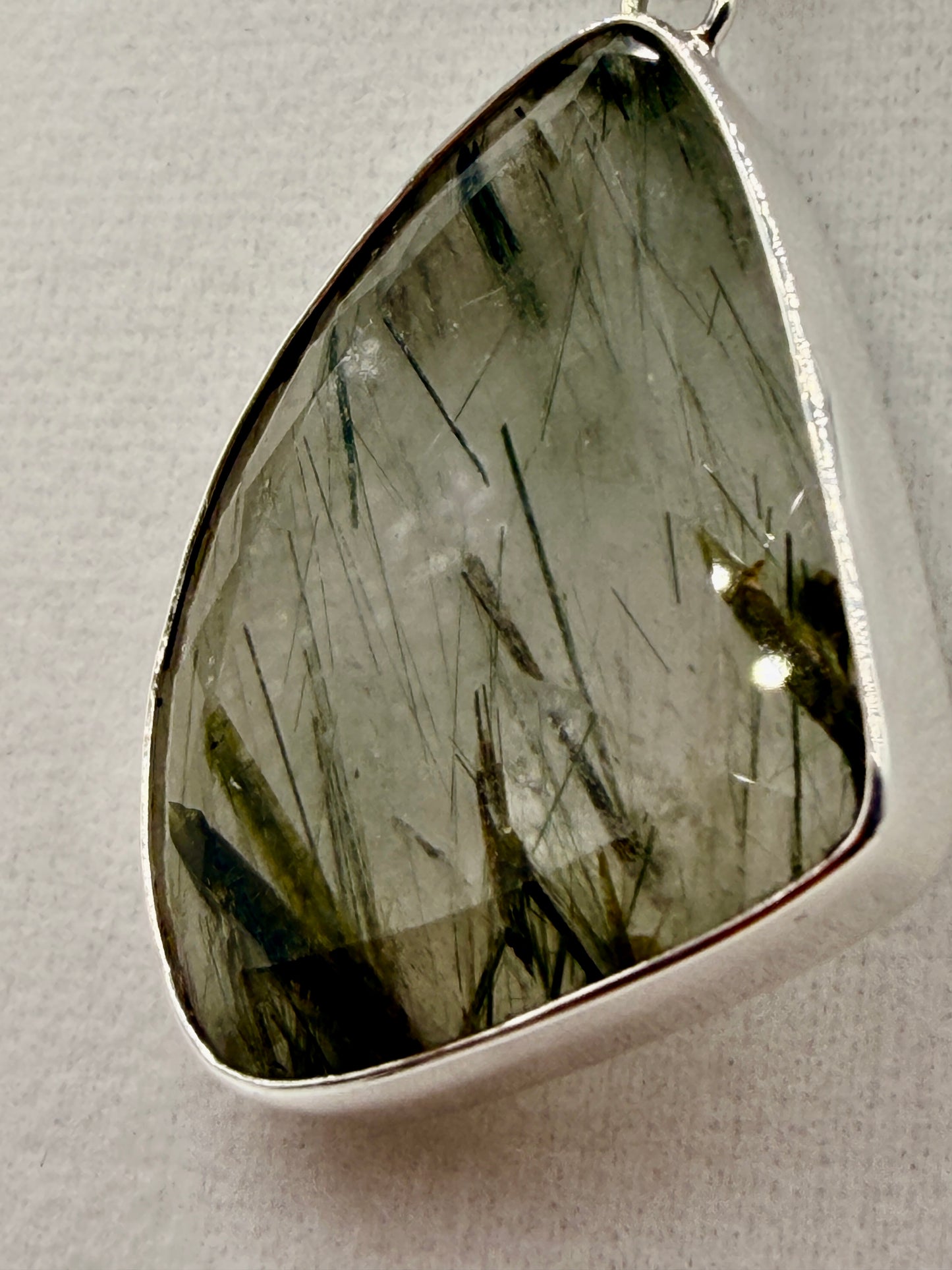 Actinolite in Quartz Pendants