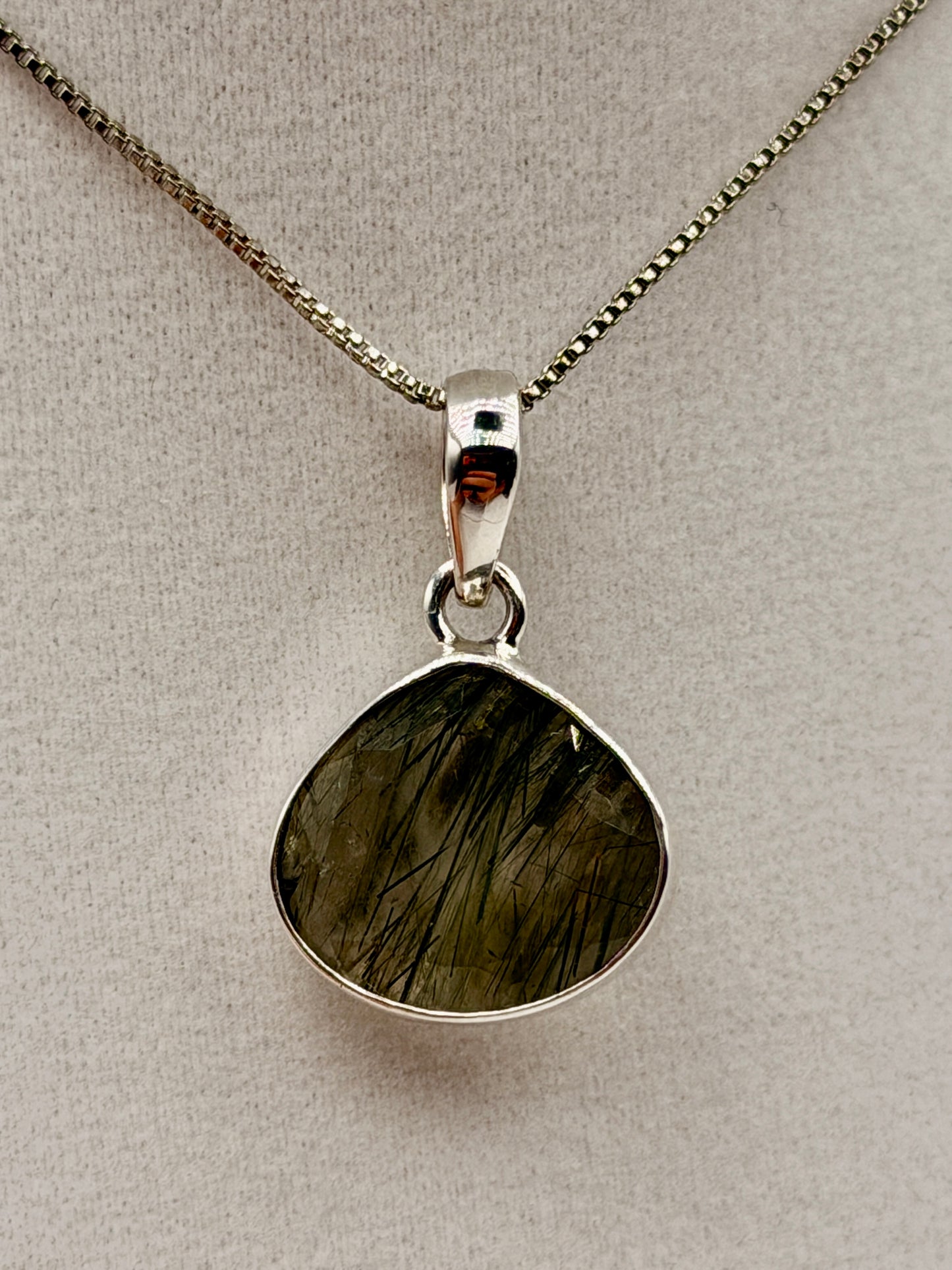 Actinolite in Quartz Pendants