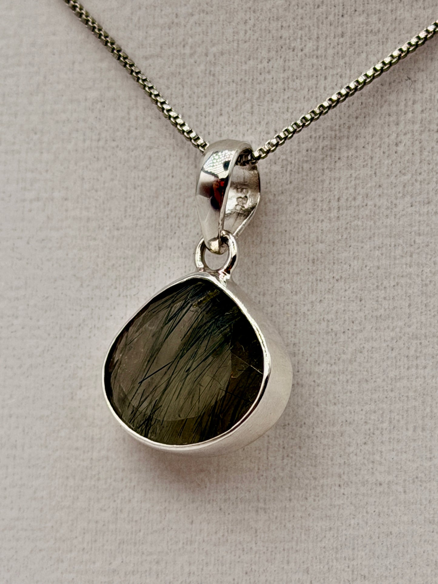 Actinolite in Quartz Pendants