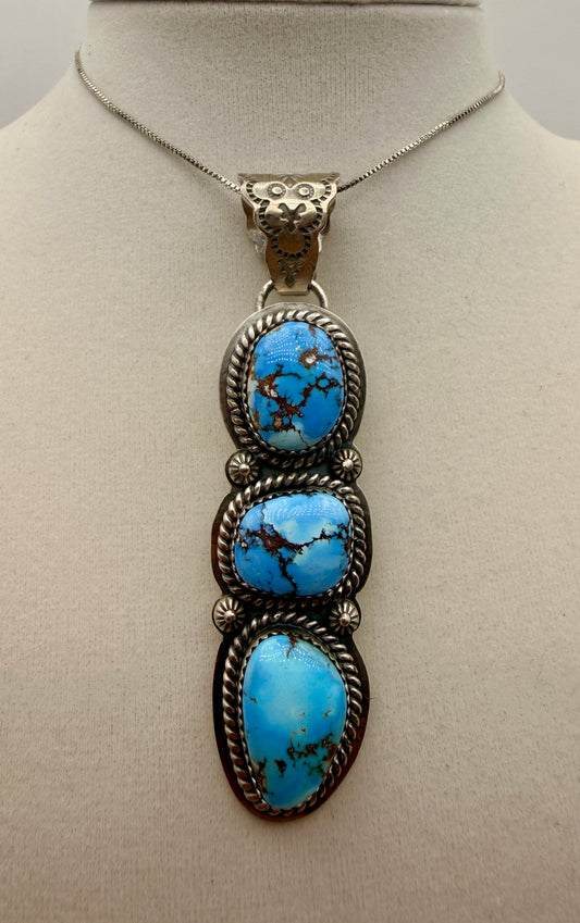 Three-stone Golden Hills turquoise sterling silver pendant with ornate owl-motif bail