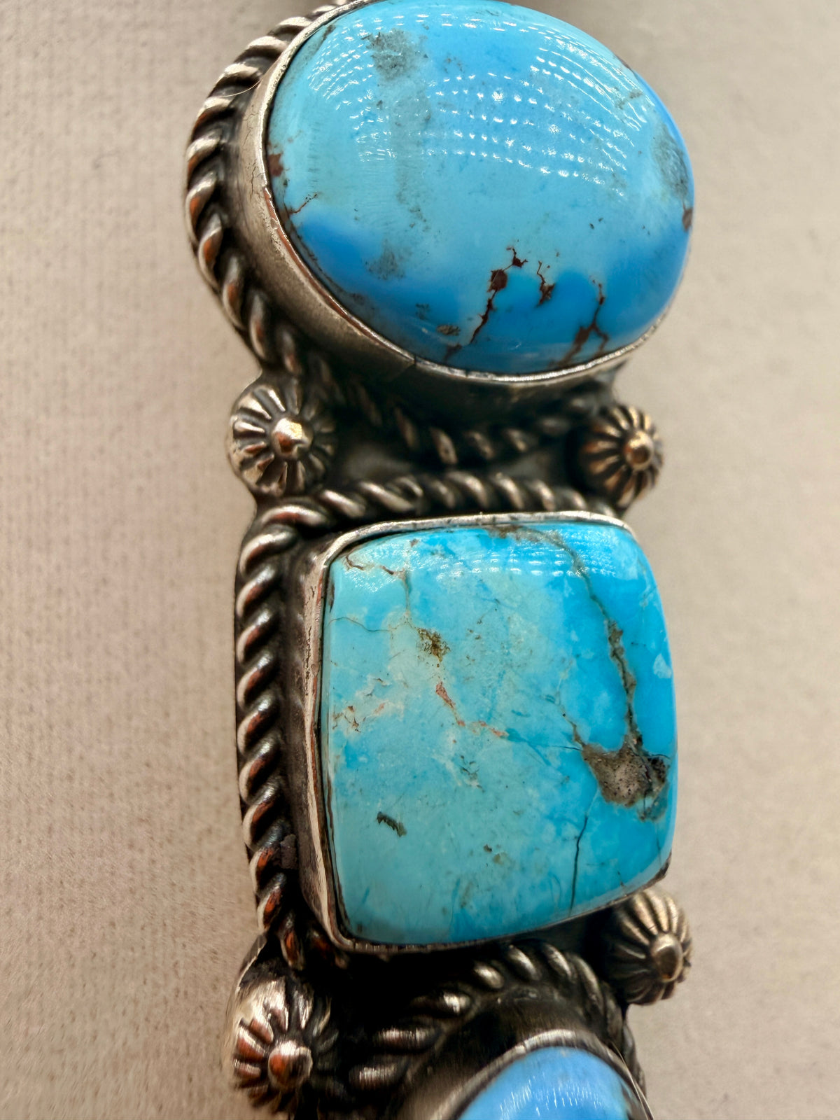 Close-up of blue Golden Hills turquoise cabochons and oxidized sterling silver details