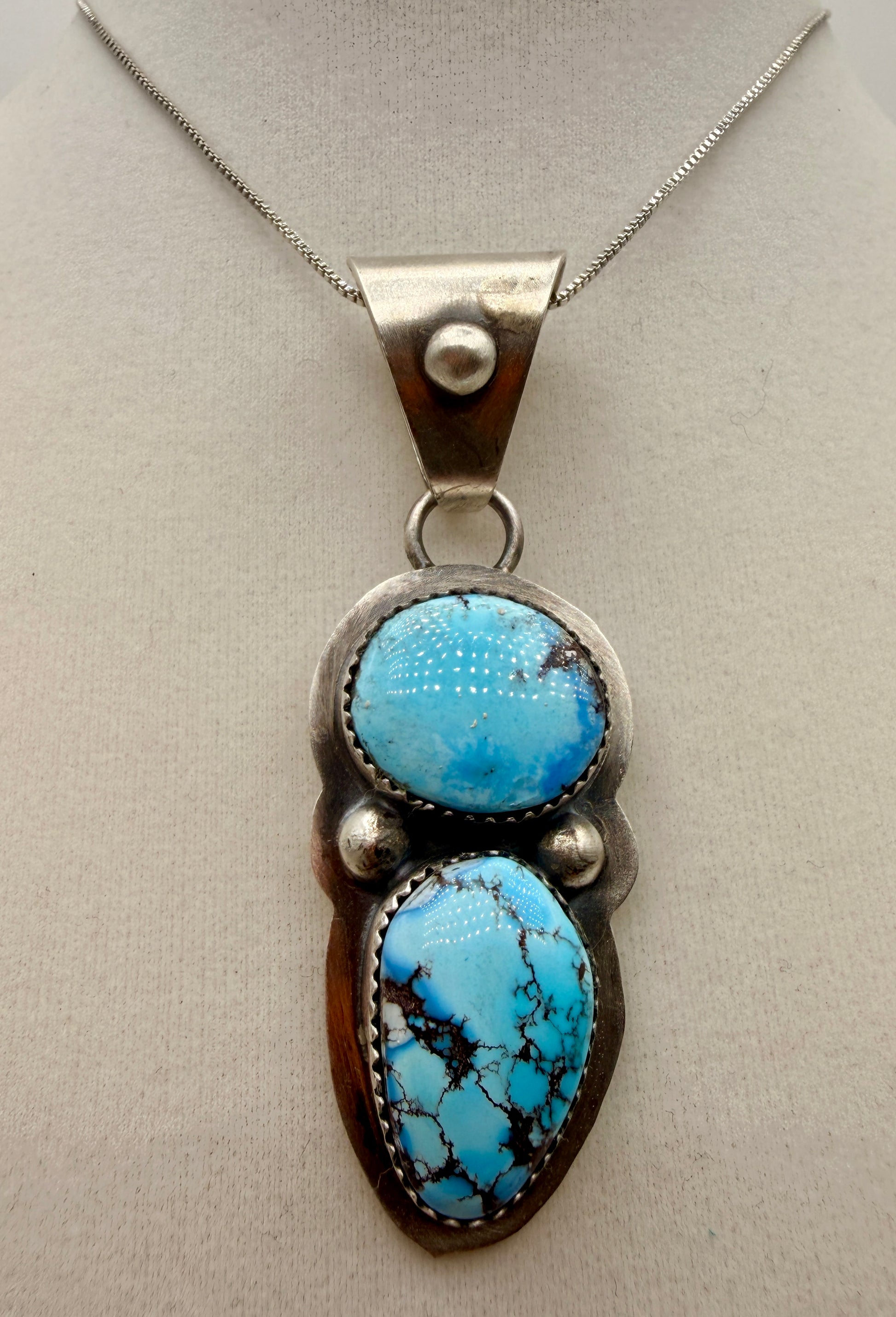 Dilbert Secatero two-stone Golden Hills turquoise sterling silver pendant shown from the front