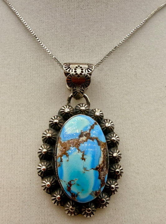 Ned Nez Golden Hills turquoise sterling silver floral pendant shown from the front