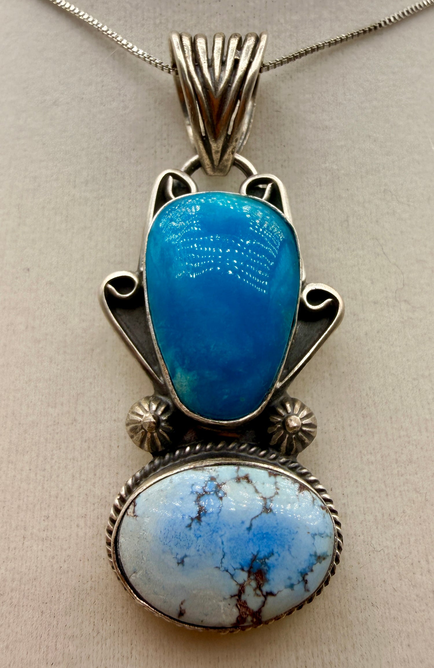 T. Nez Sr. Golden Hills and blue turquoise two-stone sterling silver pendant