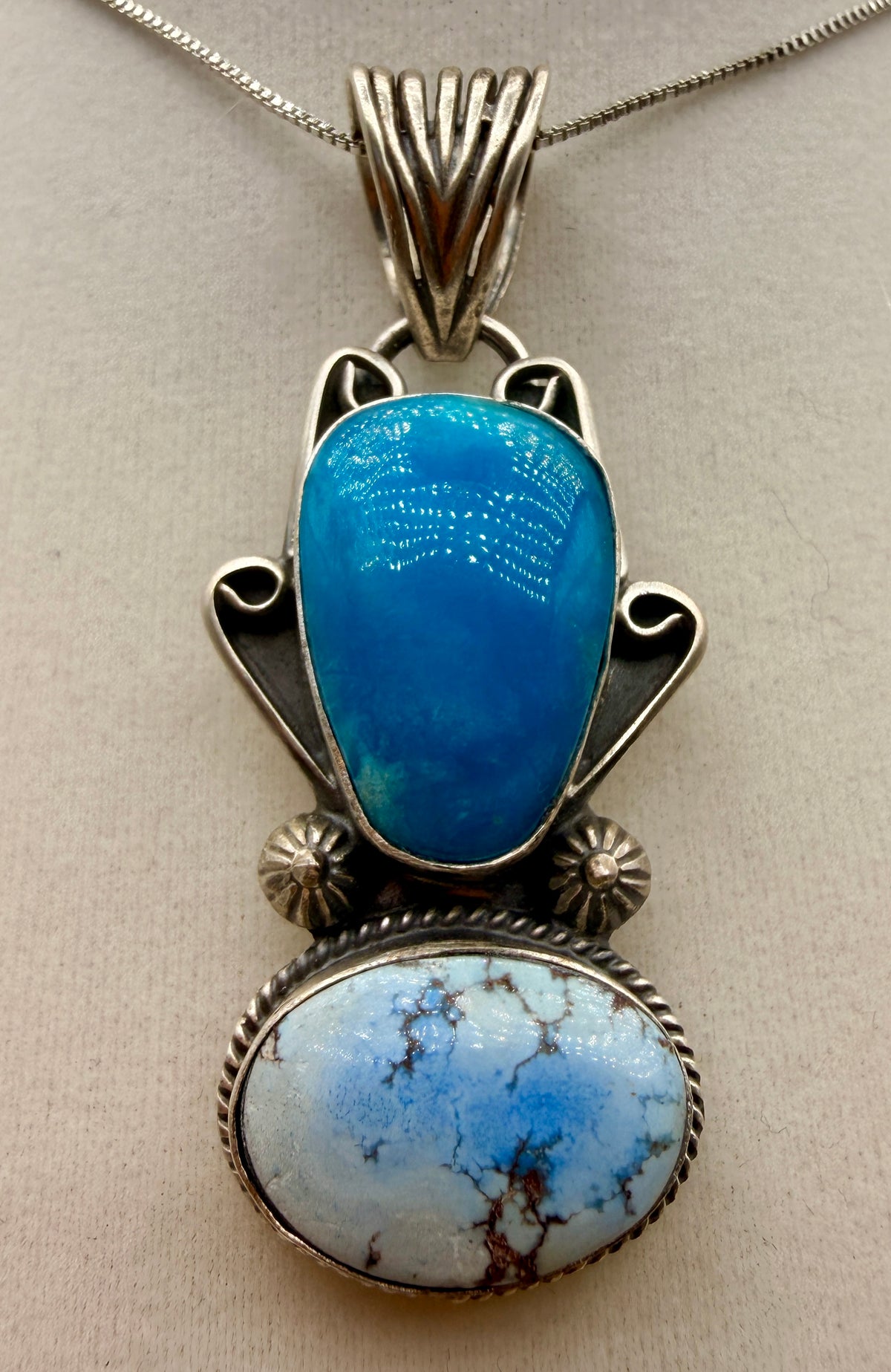 T. Nez Sr. Golden Hills and blue turquoise two-stone sterling silver pendant