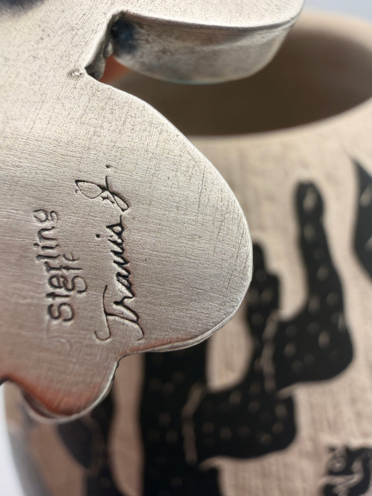 Travis Jim artist signature and Sterling stamp on the back of the adjustable ring