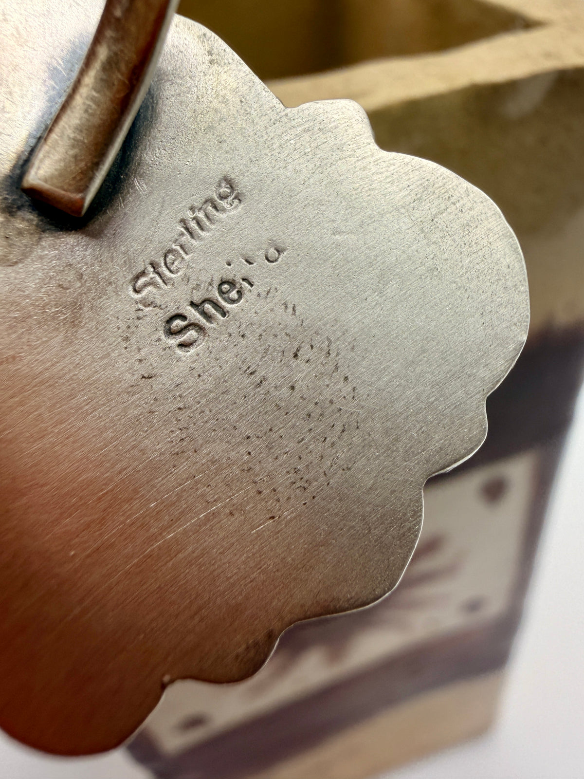 Sheila Tso artist hallmark and Sterling stamp on the back of the adjustable ring