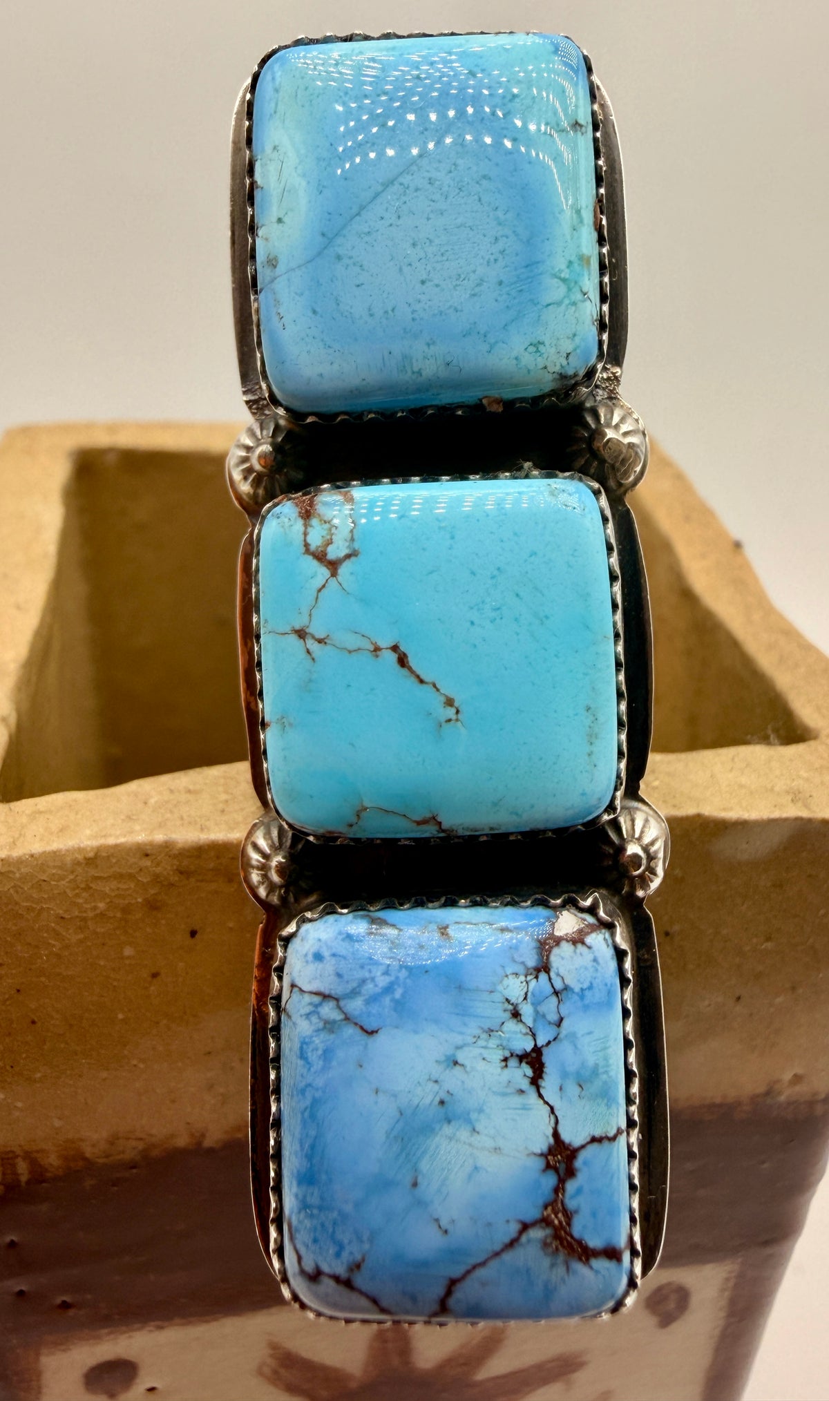Three-stone Golden Hills turquoise adjustable sterling silver statement ring shown from the front