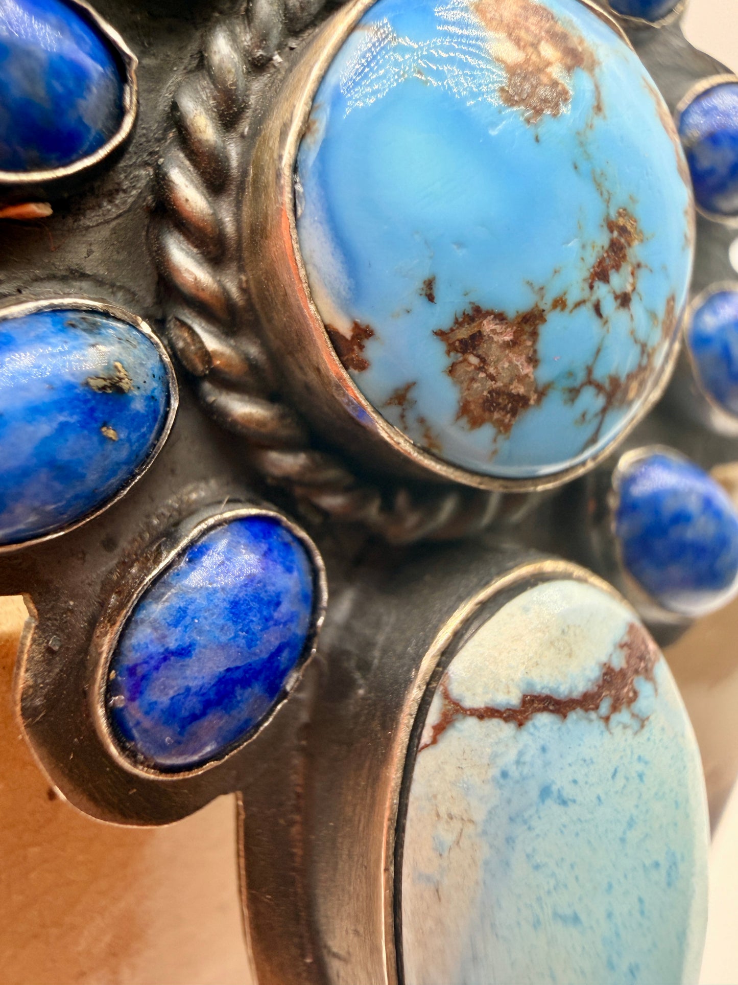 Close-up of Golden Hills turquoise matrix and lapis lazuli cabochons