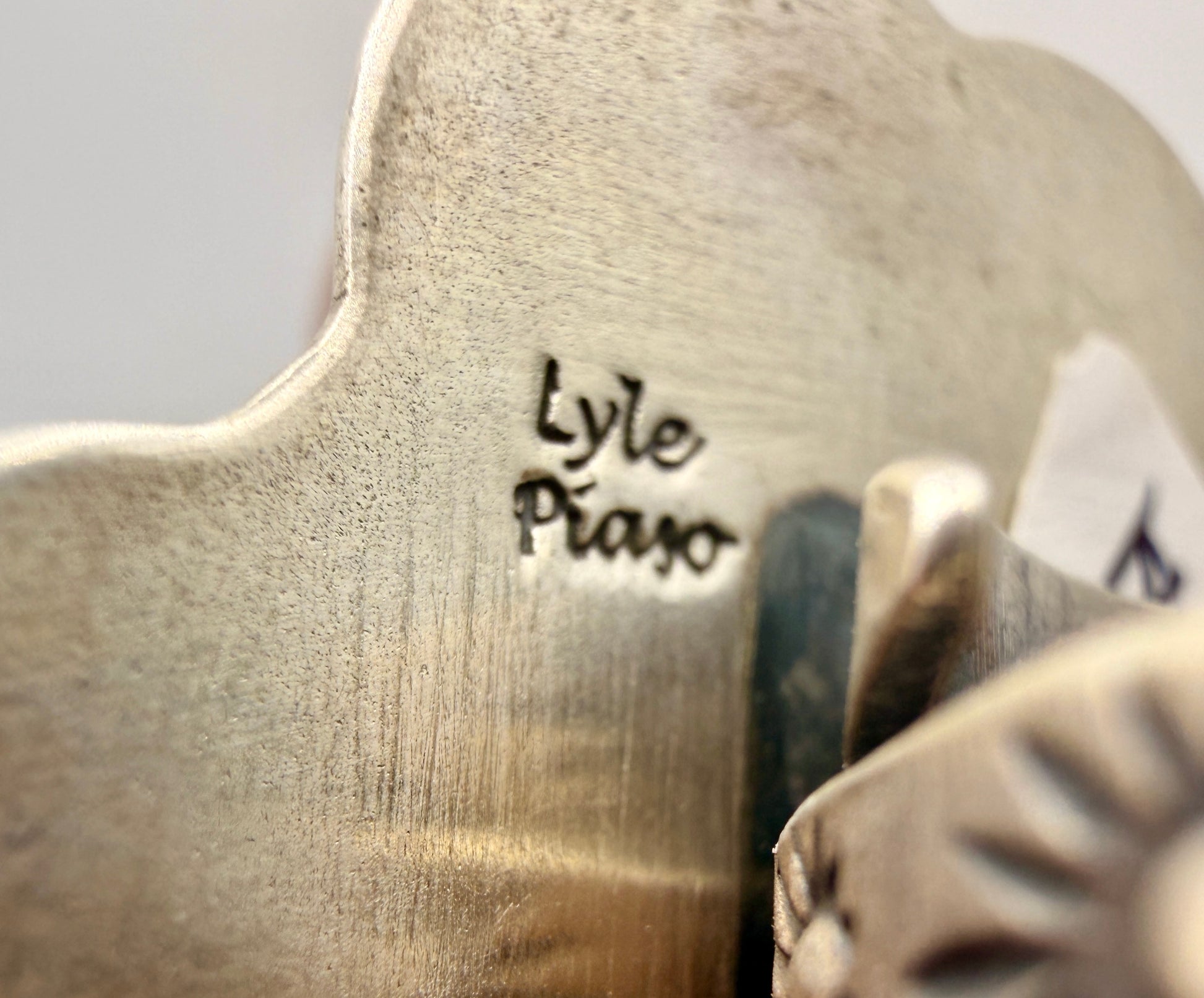 Lyle Piaso artist hallmark on the back of the sterling silver ring