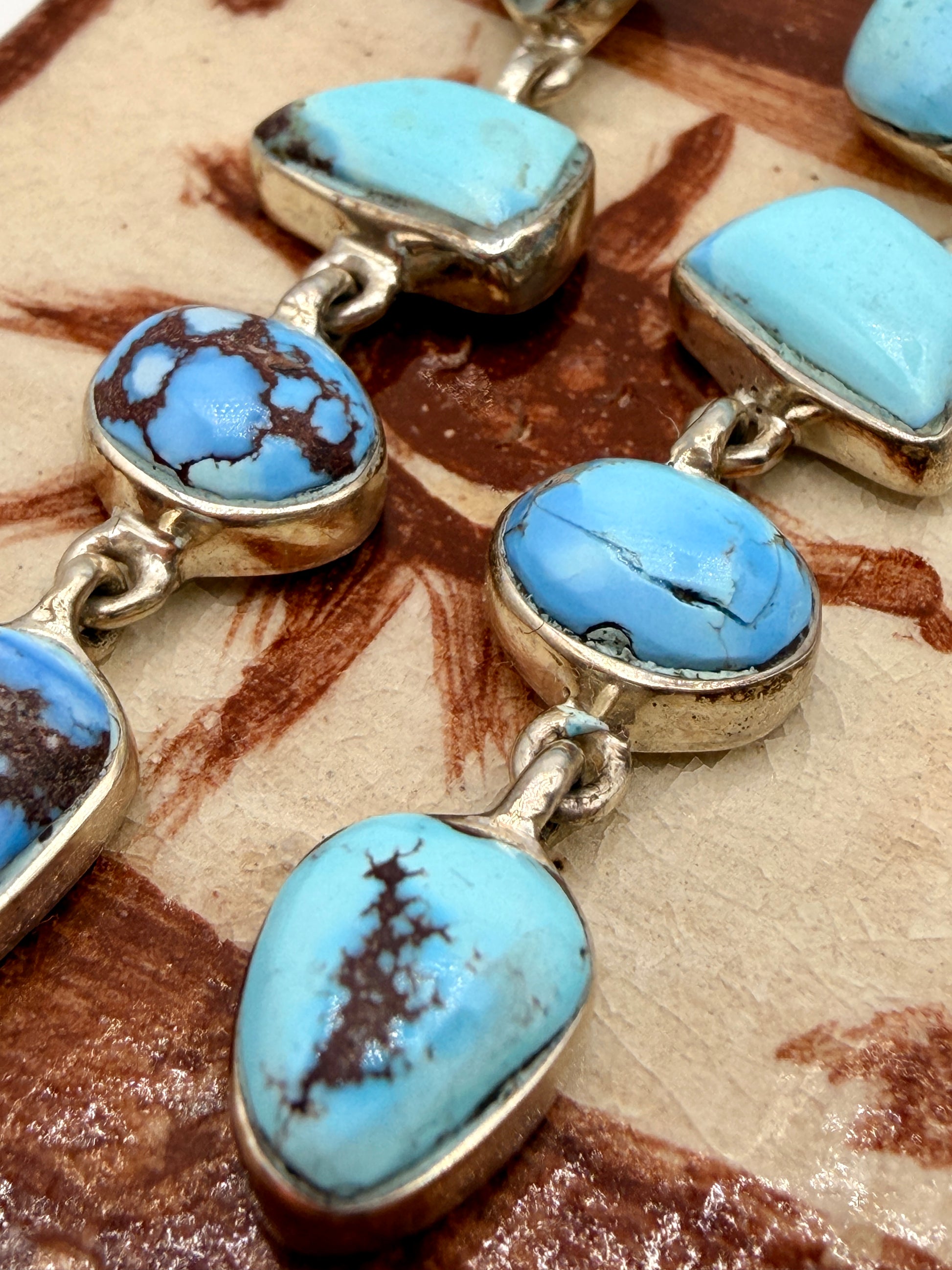 Close-up of sky-blue Golden Hills turquoise with natural brown matrix