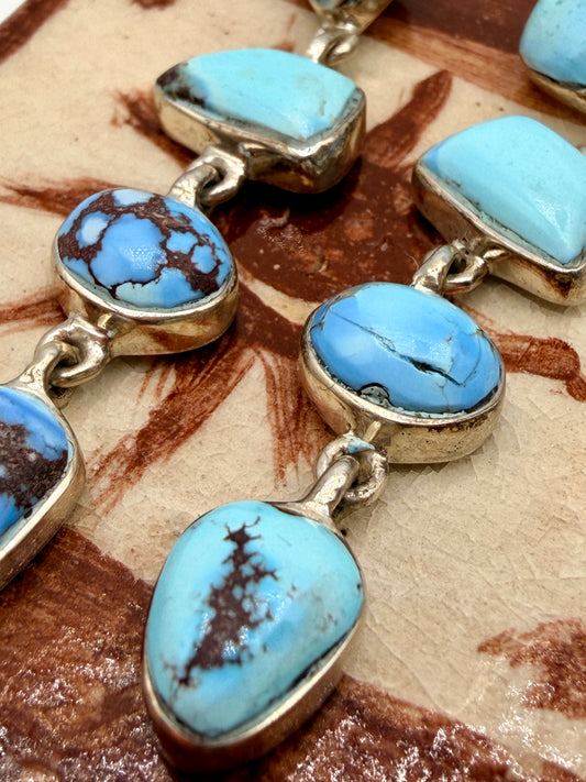Close-up of sky-blue Golden Hills turquoise with natural brown matrix