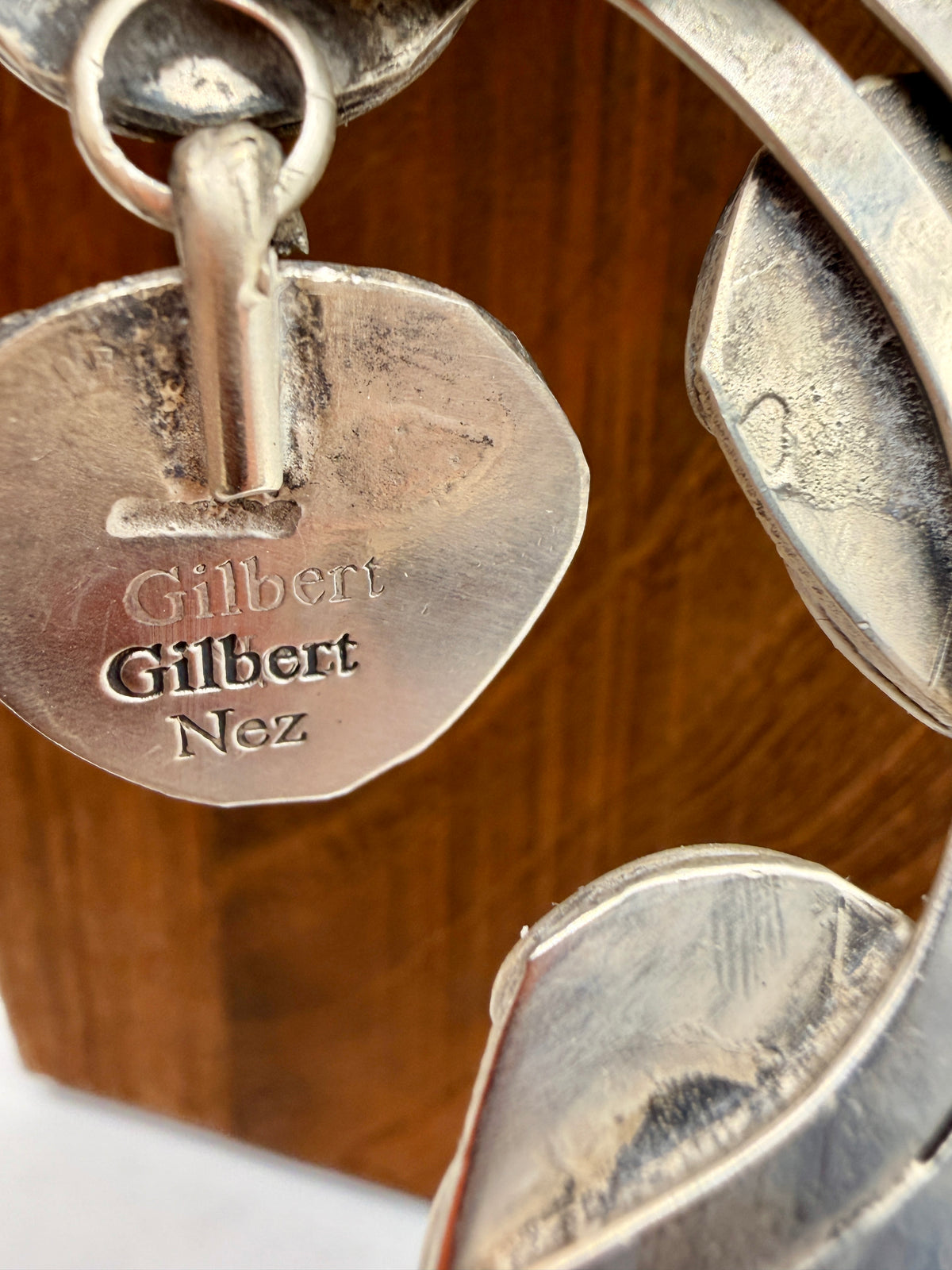Gilbert Nez artist hallmark on back of squash blossom necklace