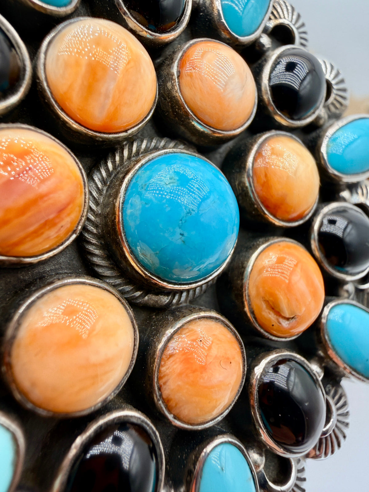 Close-up of Sleeping Beauty Turquoise, Spiny Oyster and Black Onyx statement pendant