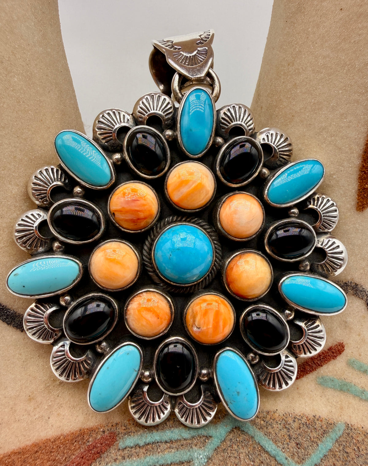 Front view of multi-stone Sleeping Beauty Turquoise, Spiny Oyster and Black Onyx pendant