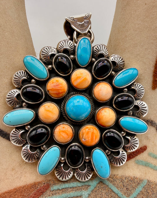 Front view of multi-stone Sleeping Beauty Turquoise, Spiny Oyster and Black Onyx pendant