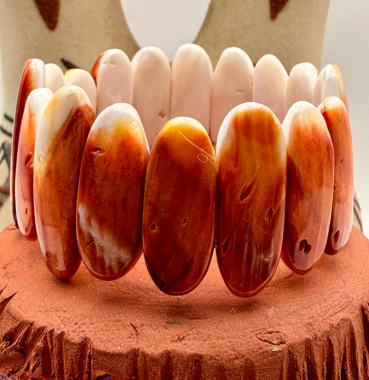 Spiny Oyster shell bracelet with elongated orange cream and rust shell pieces