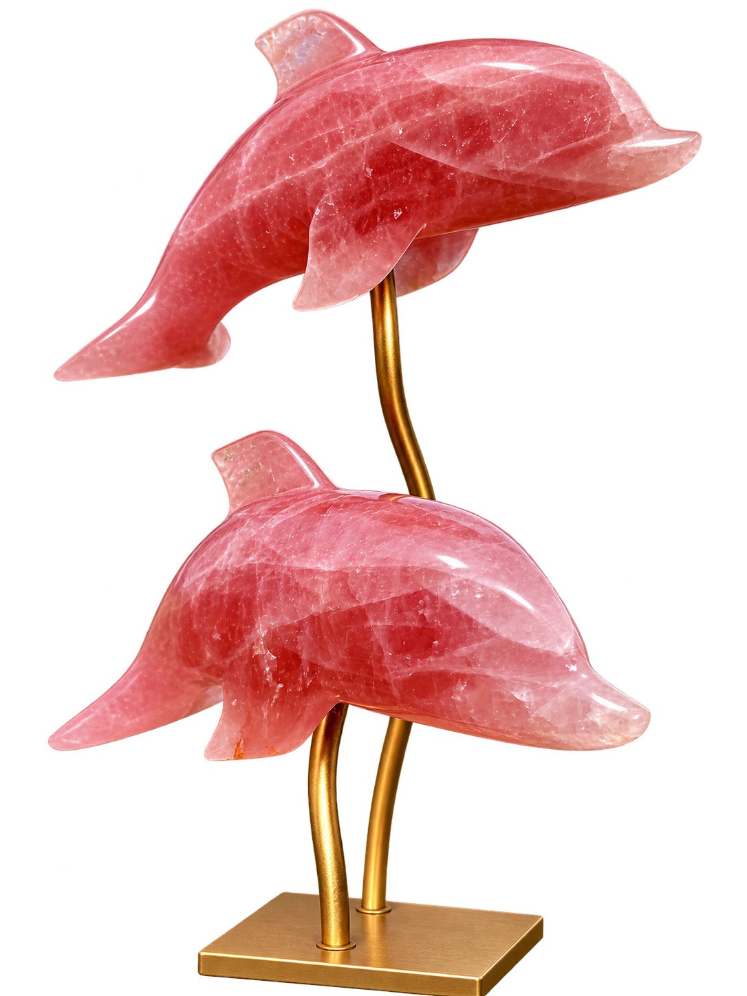 Side view of two rose quartz crystal dolphins mounted on an elegant golden metal stand