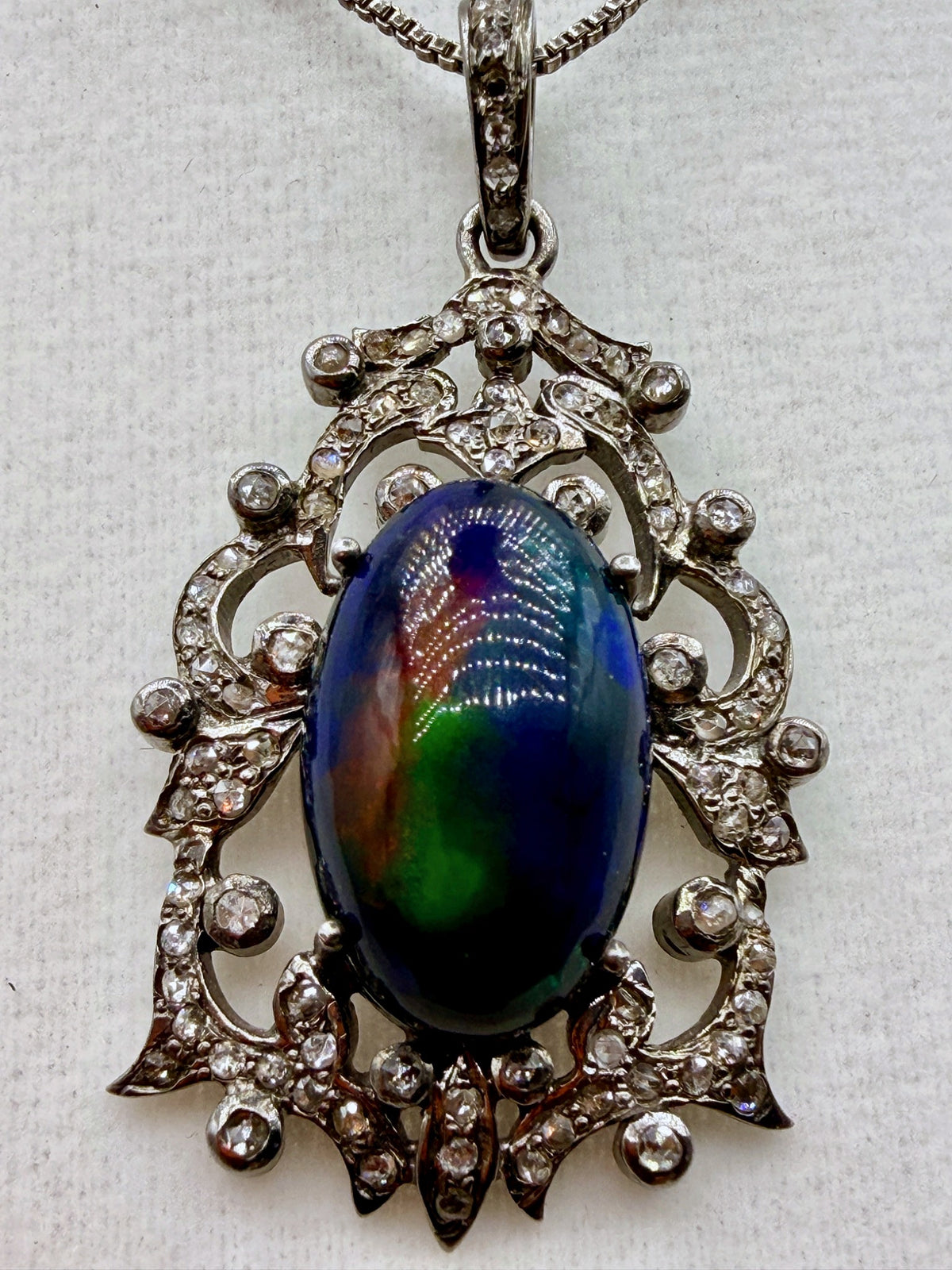 6.75 carat Australian black opal and .87 carat diamond pendant in sterling silver with vivid blue green and red play-of-color