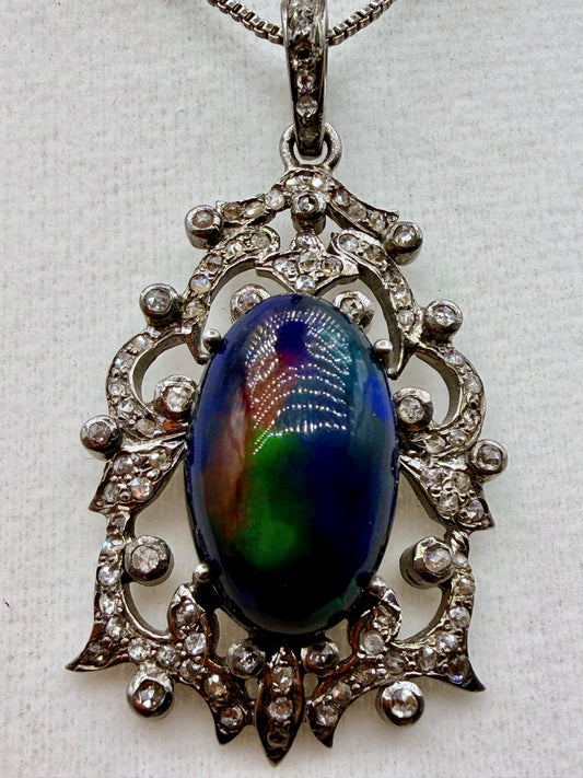 6.75 carat Australian black opal and .87 carat diamond pendant in sterling silver with vivid blue green and red play-of-color