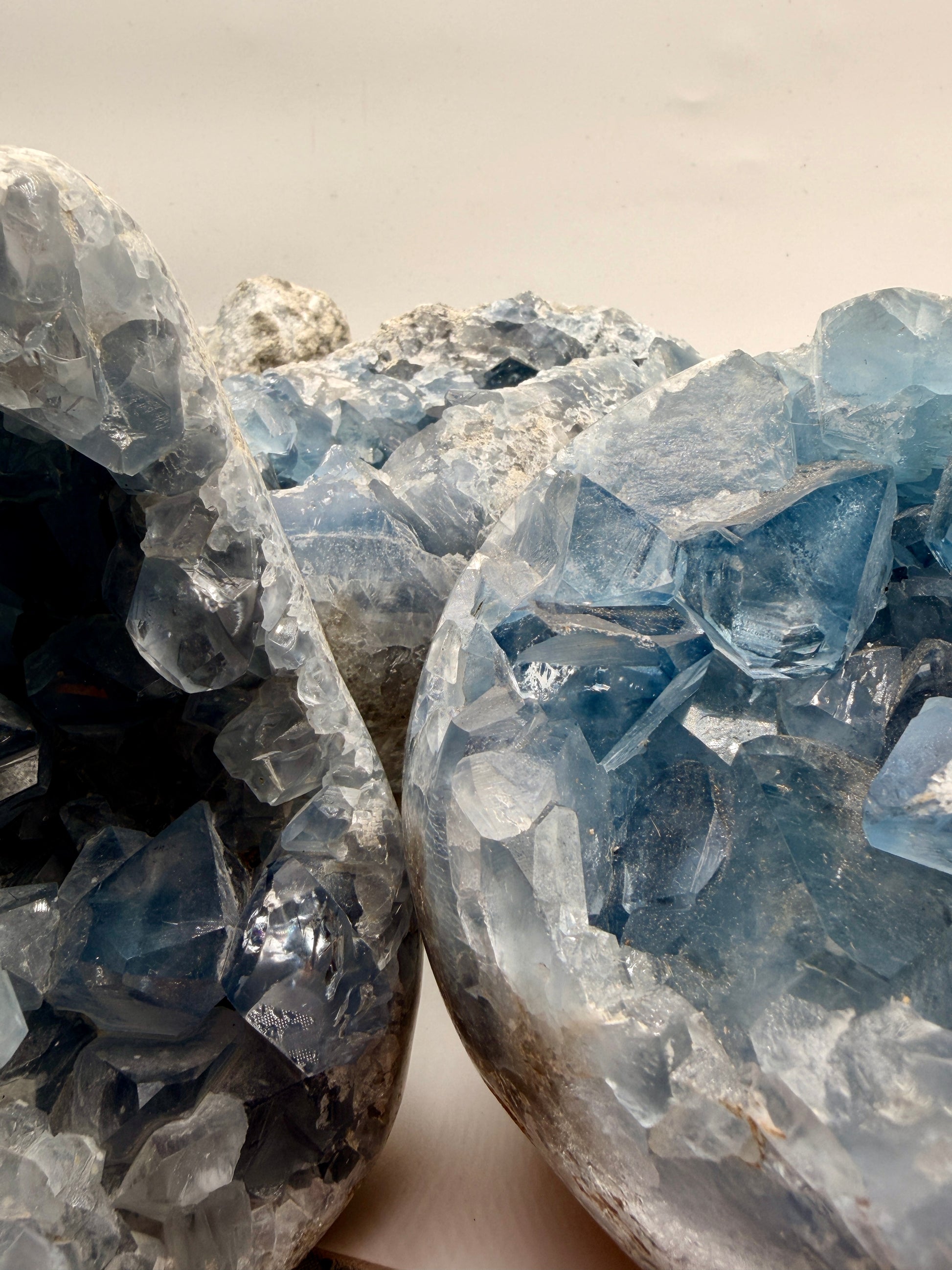 Premium Blue Celestite crystal specimen from Madagascar featuring brilliant sky-blue crystal formations within polished geodes, free forms, and spheres.