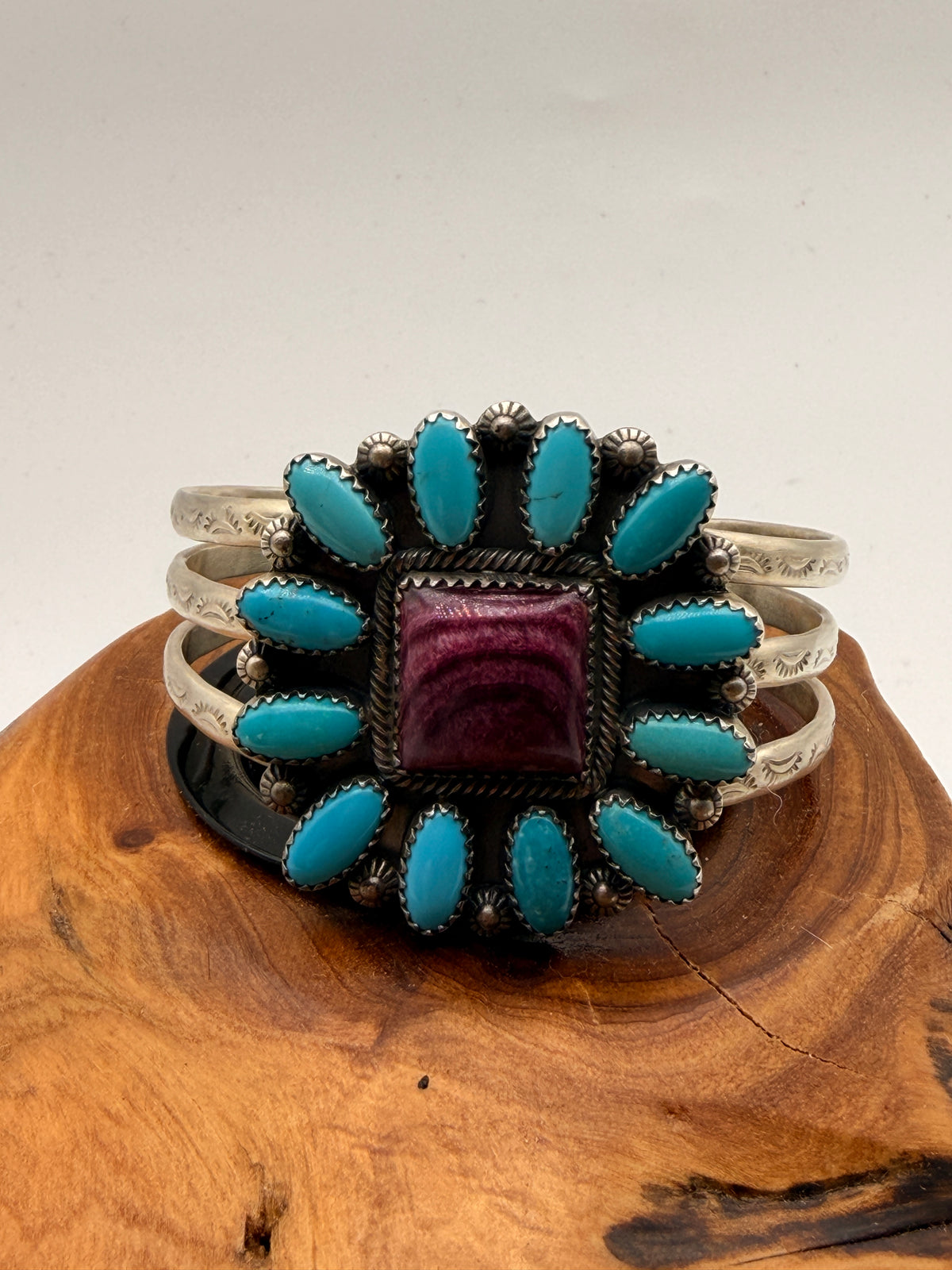 Handcrafted sterling silver cuff bracelet featuring natural turquoise and Spiny Oyster shell in a Southwestern cluster design